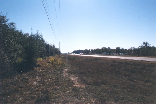 Looking south along US-27. The confluence is in the woods, to the left.