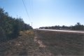 #4: Looking south along US-27. The confluence is in the woods, to the left.