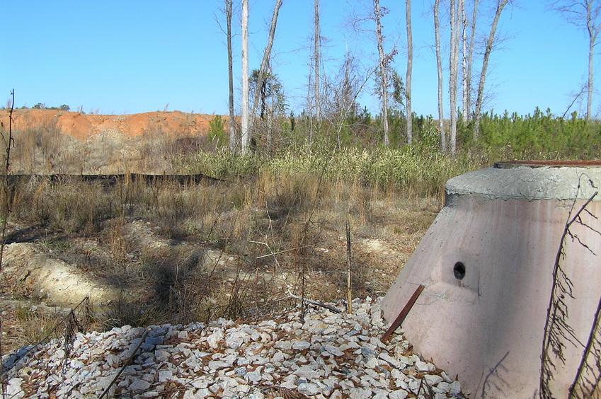 View to the north showing the confluence, behind the thorns and shrubs, showing new sewer as part of the new housing development being constructed here.