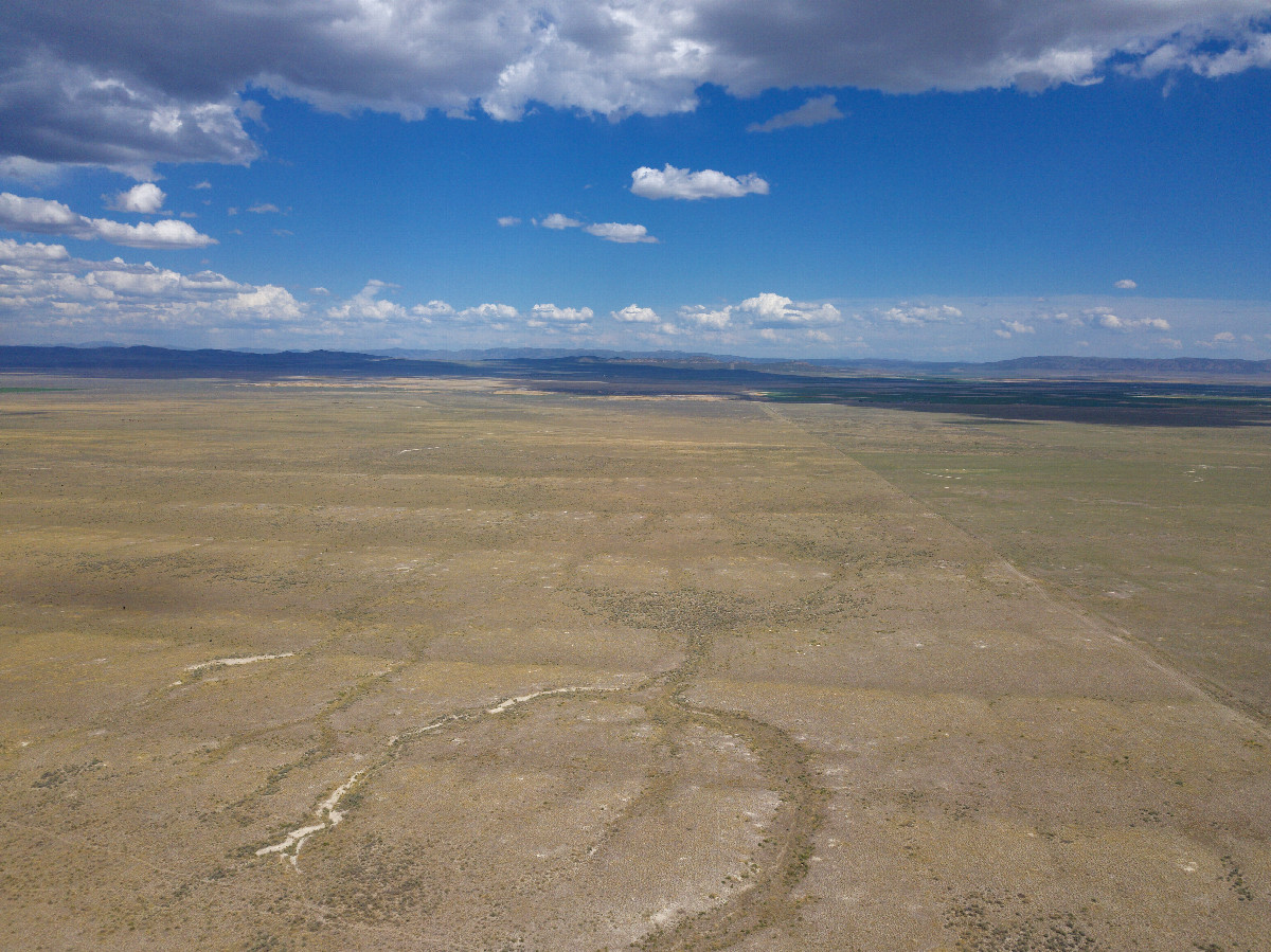 View East (along the Idaho-Utah state line), from 120m above the point