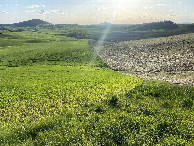 #10: View of the nearest road to the west of confluence… Down this slope in the distance.  