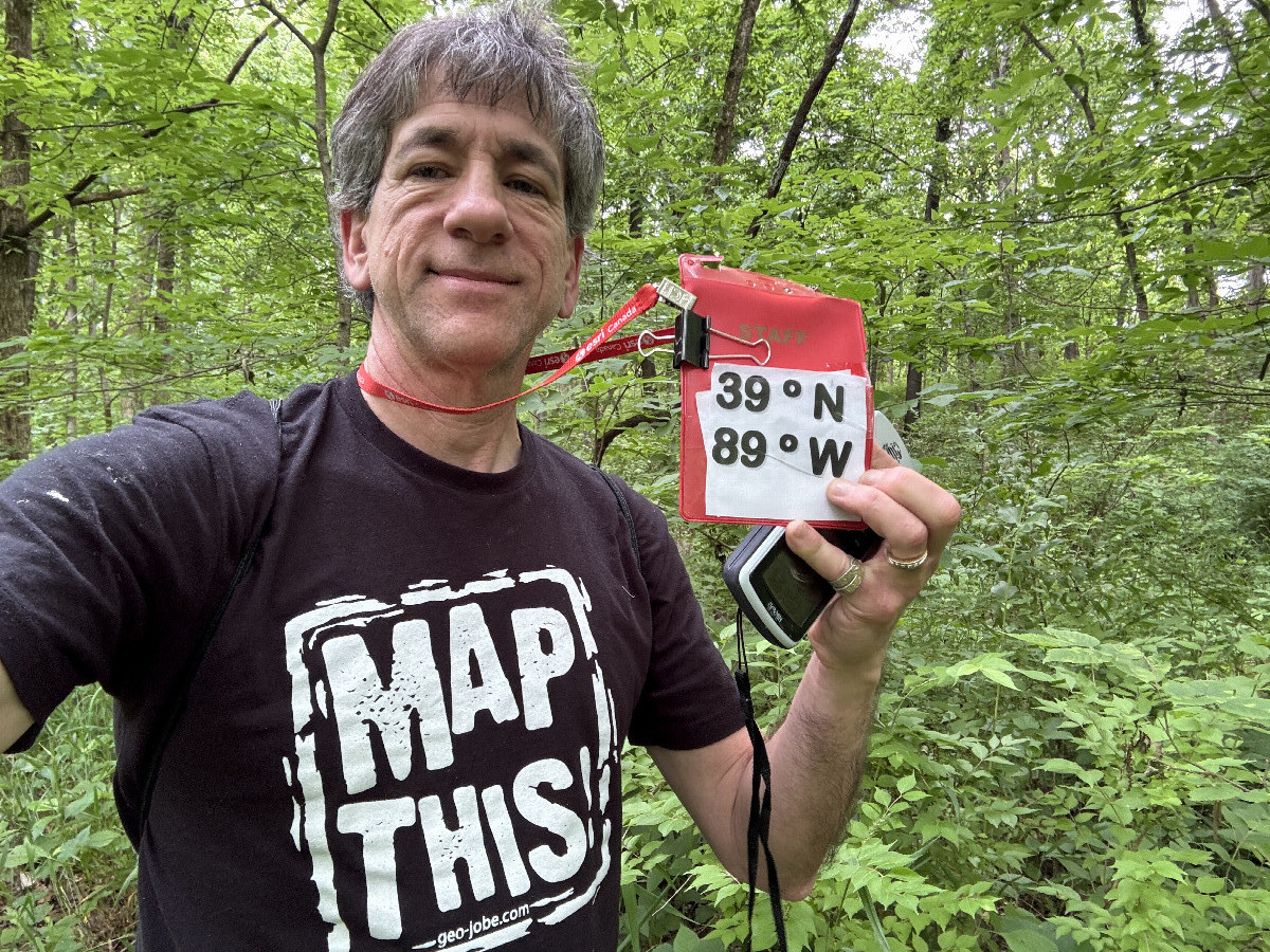 Joseph Kerski with mapping shirt at the confluence point.