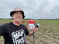 #7: Joseph Kerski with mapping shirt at confluence point.