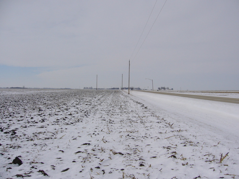 West: field and road