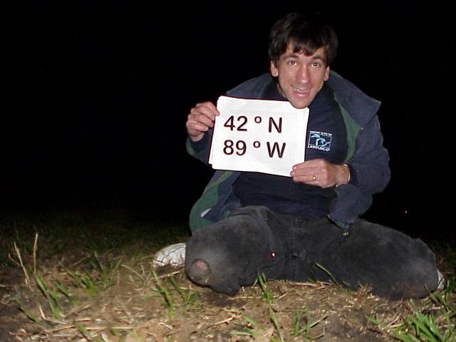 Joseph Kerski at the confluence site clad in Latitude shirt.