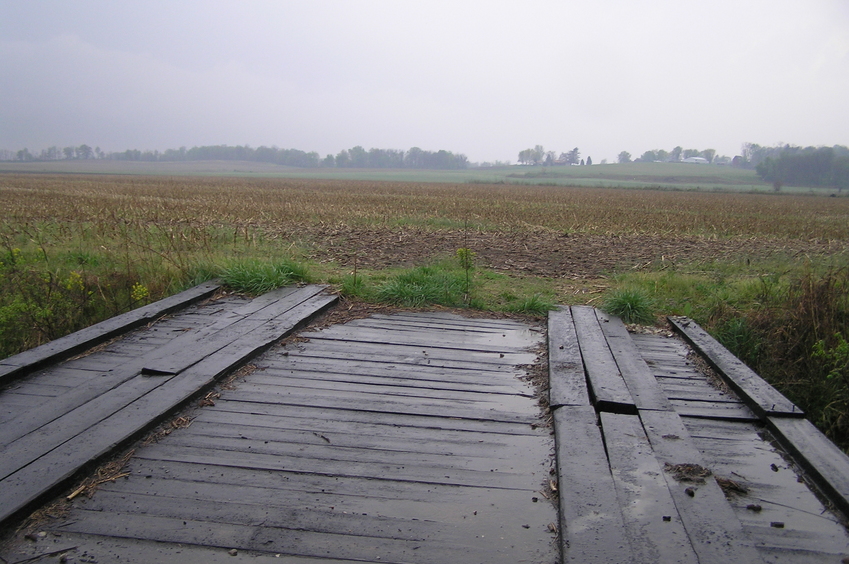 The confluence of 39 North 87 West lies just 20 meters on the other side of this bridge, in the middle of the photograph; looking southwest.