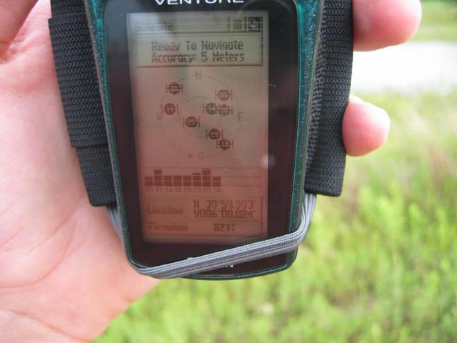 Holding the GPS as close to the site as I could get (without getting my feet muddy)