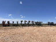 #9: Colorful combines at rest where I parked