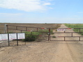 #6: Gas leases along the east-west road, looking east, Kansas on left, Oklahoma on right, 30 meters south of confluence. 