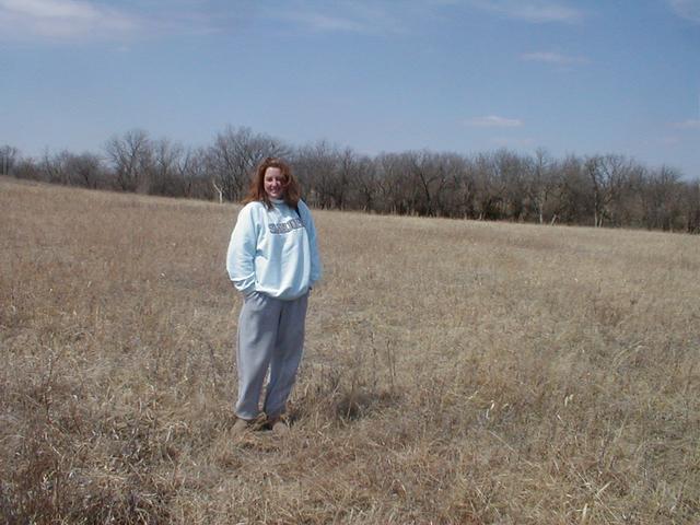 Laura stands where the lines meet