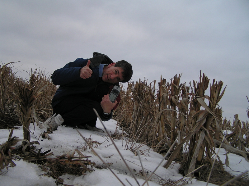 Joseph Kerski at the confluence point in the corn stalks.