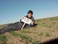 #7: Joseph Kerski lying in the field at the confluence site.