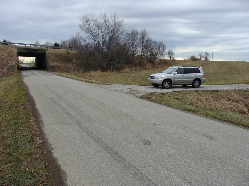 Approach from Bon Ayr:   Follow Bishop Road from east under Louie B Nunn Parkway, then immediately turn south on farm lane.