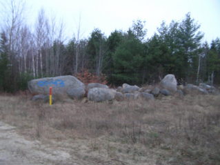 #1: Rocks alongside Stud Mill Road at the closest approach to the confluence.