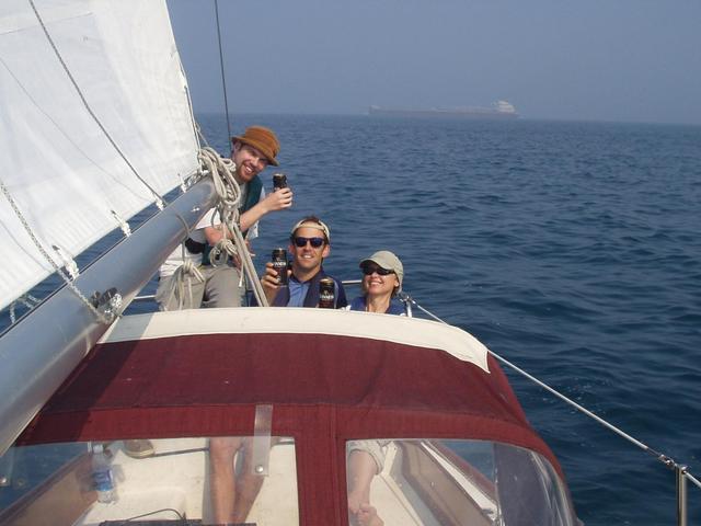 The crew celebrates while a laker passes our stern: Mitch, Andy, & Sally