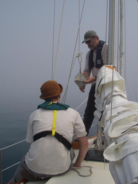The captain, Steve Culver, raises the radar reflector at the start of the journey