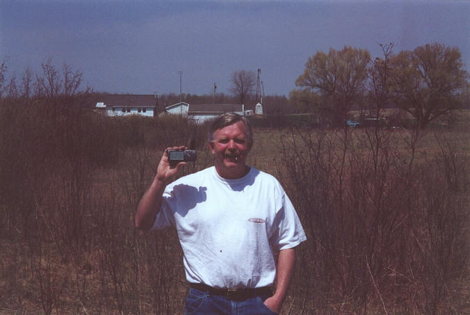 Steve at the site with Betty's farm in the background
