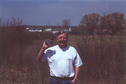#2: Steve at the site with Betty's farm in the background