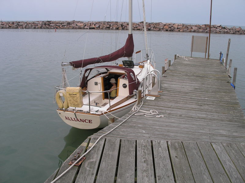 Sailing Vessel Alliance at the South Shore Yacht Club. Crew member Sally is in the companionway preparing for the overnight passage.