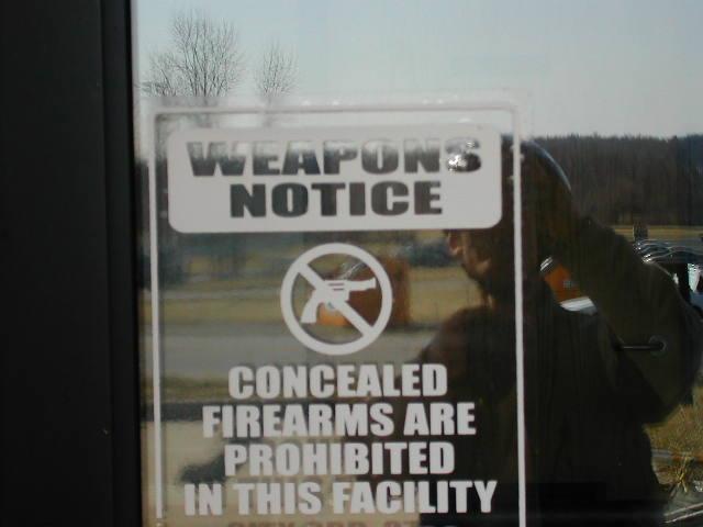 his disturbing sign was seen just about everywhere I went...  Does EVERYONE in the US carry a gun these days?