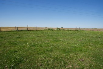 #1: The confluence point lies in this grassy farm field. (This is also a view to the North)