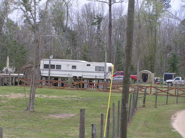 Innovative Mississippi housing:  Camper on stilts, with porch built off the back, 20 km southwest of confluence.