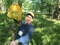 #4: Joseph Kerski at the confluence point with Not All Who Wander Are Lost bag. 