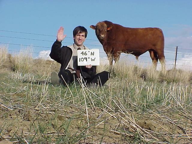 Joseph Kerski and unnamed cow pose at 46 North 109 West.