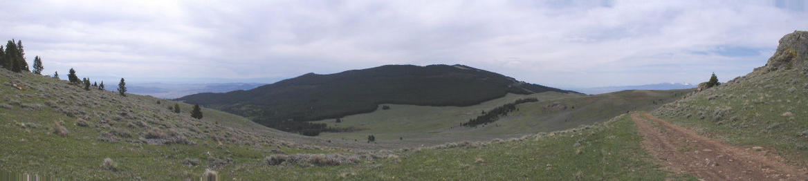 Panorama of the approach route. Confluence is low on ridge across valley.