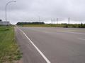 #5: The view South along Highway 3 showing a field of sunflowers in the distance.