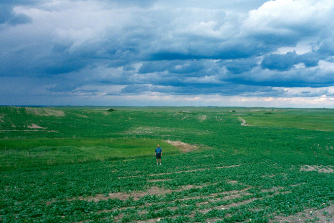 John at confluence, behind him is to the north