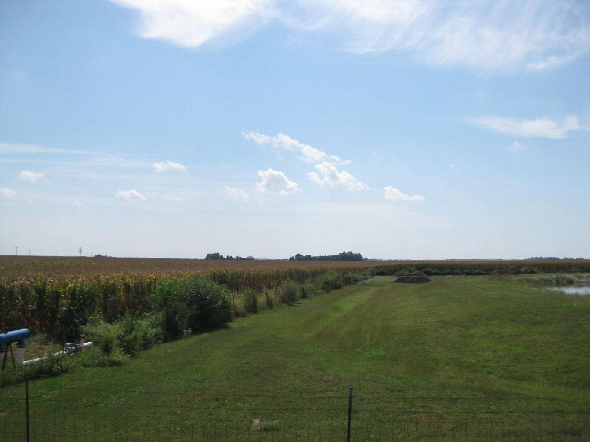 Looking SSE across the water treatment facility to the confluence in the cornfield