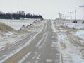 #7: View on nearest road, 150 meters west of the confluence, looking south.