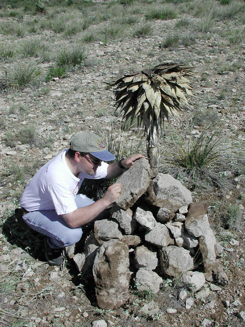 Nathan scratching the details on the cairn