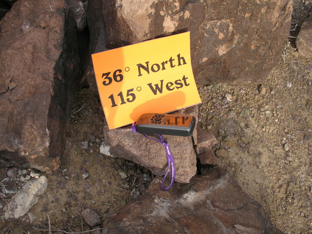 GPS and Sign Sitting on Rock at CP