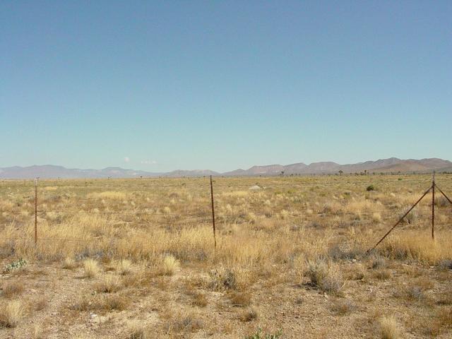 Small Concrete Structure on Other side of Fence is Plug Covering Hole where an Underground Nuclear Test was Conducted