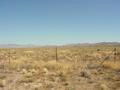 #5: Small Concrete Structure on Other side of Fence is Plug Covering Hole where an Underground Nuclear Test was Conducted