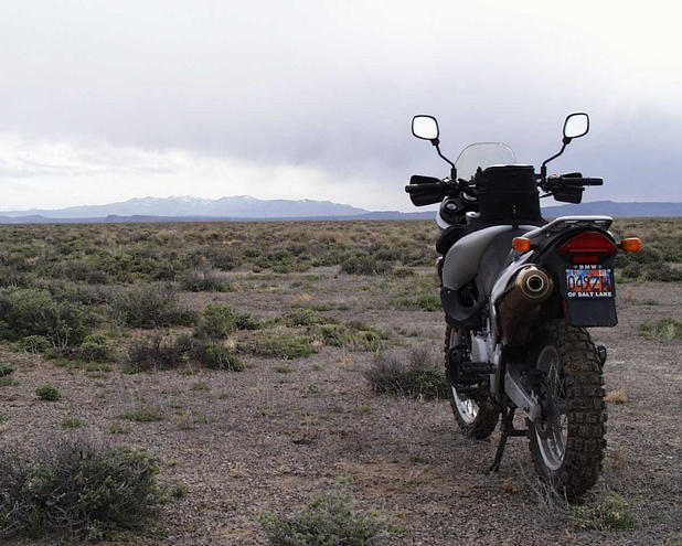 Motorcycle sits on the confluence facing SSW towards the mountains surrounding Golfield, NV.