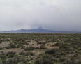 #2: Facing south looking through the Ralston Valley towards Cactus Peak and the remnants of the rain storm I rode through