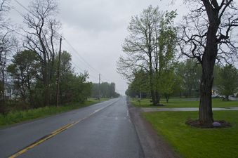 #1: The confluence point lies on the paved road, near the bottom of this photo.  (This is also a view to the North)