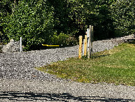 #12: The entrance to the utility access path, off W. River Road, 0.94 miles West of the point