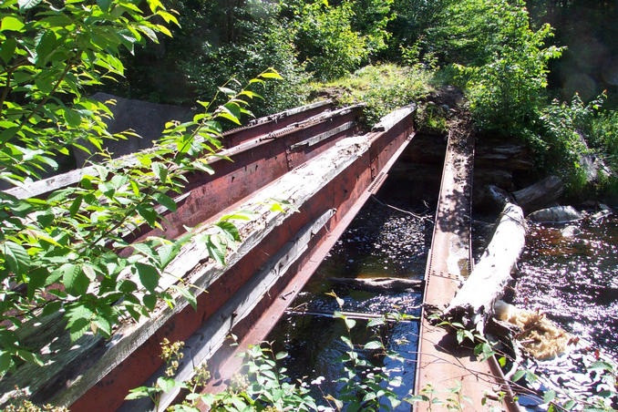 Destroyed bridge at the end of the road