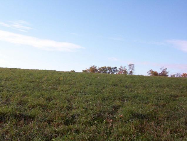 View  to the south over the rise where the car is parked.