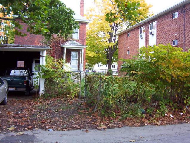 Looking north across the alley to more apartment buildings.