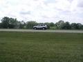 #2: View West from near the confluence point. (Our rental car across Ohio SR-235.)