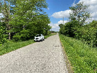 #12: View of vehicle and closest road to the confluence, looking east. 