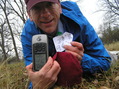 #2: Joseph Kerski at the confluence point, lying down in the rain in the field.