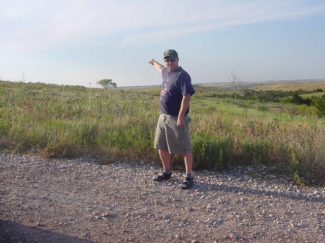 Eric points the way. The confluece is about 100 ft. north of that lonely tree.