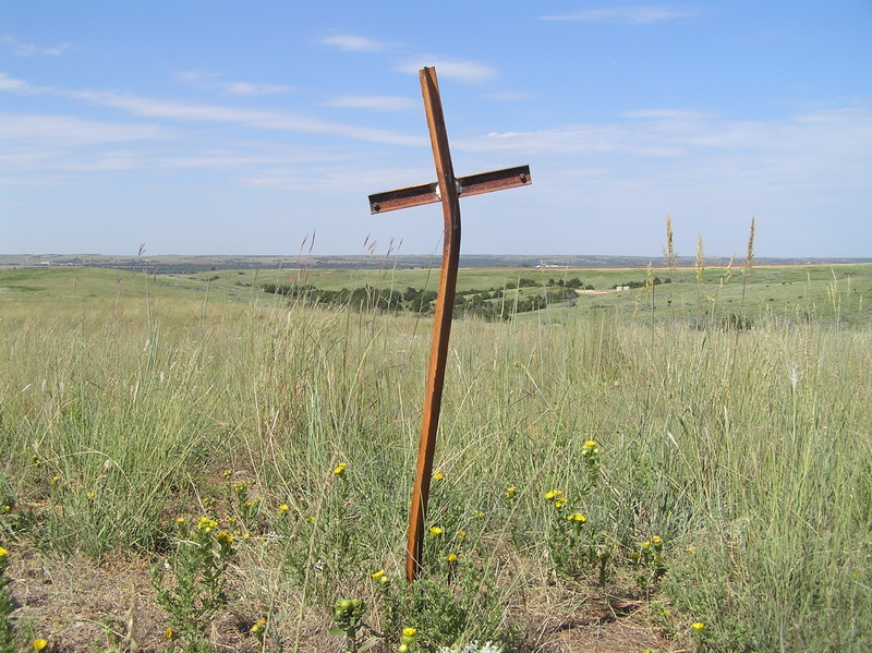 Cross in the ground about 25 meters south-southwest of the confluence.