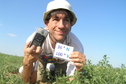 #9: Joseph Kerski lying in the field at the confluence point.